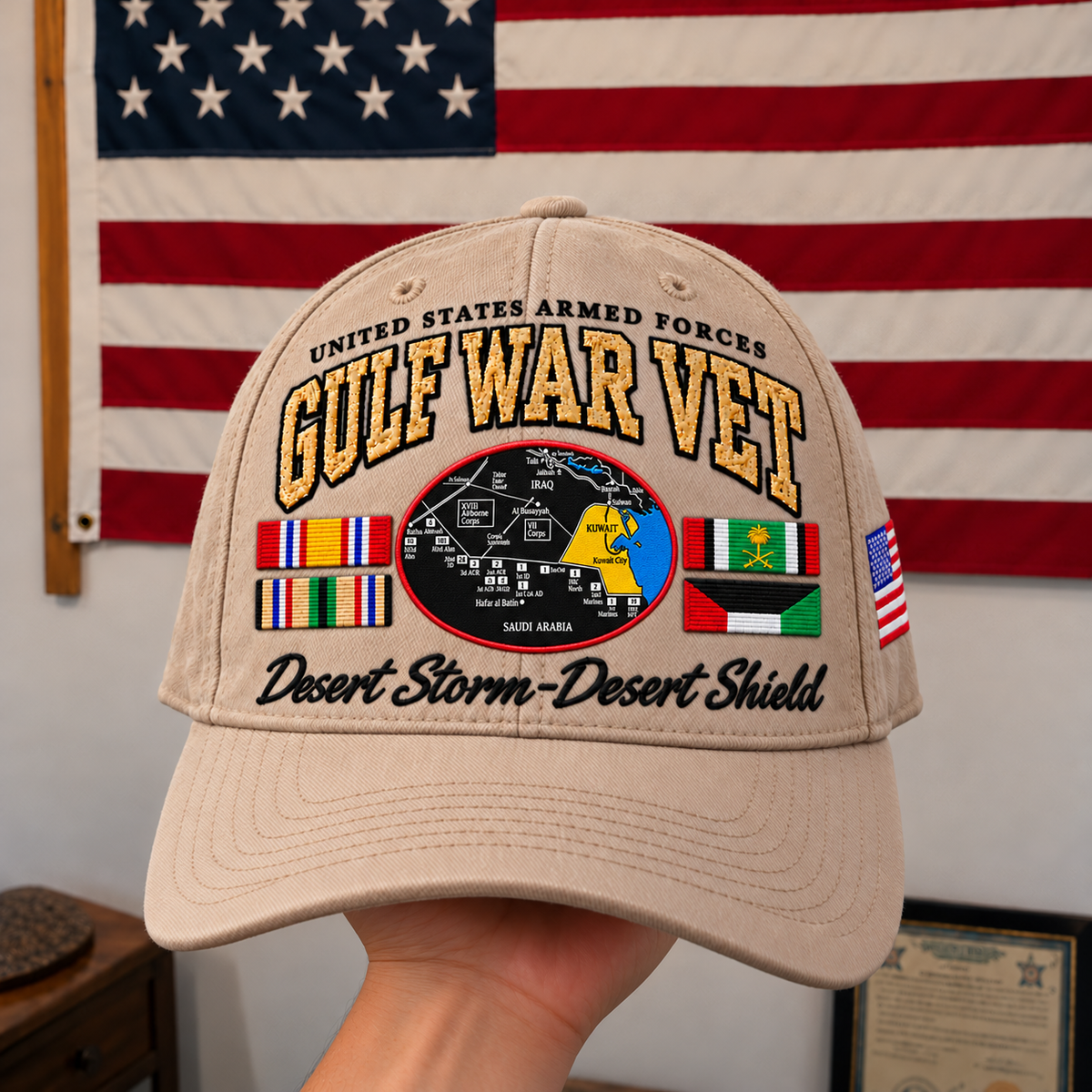 Front embroidery of the khaki Gulf War veteran cap against an American flag