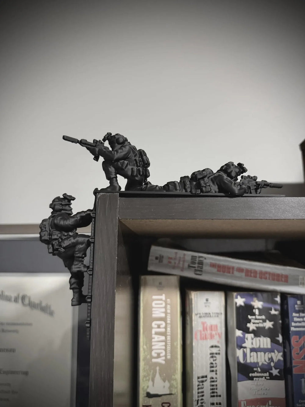 Miniature tactical team displayed on the corner of a bookcase