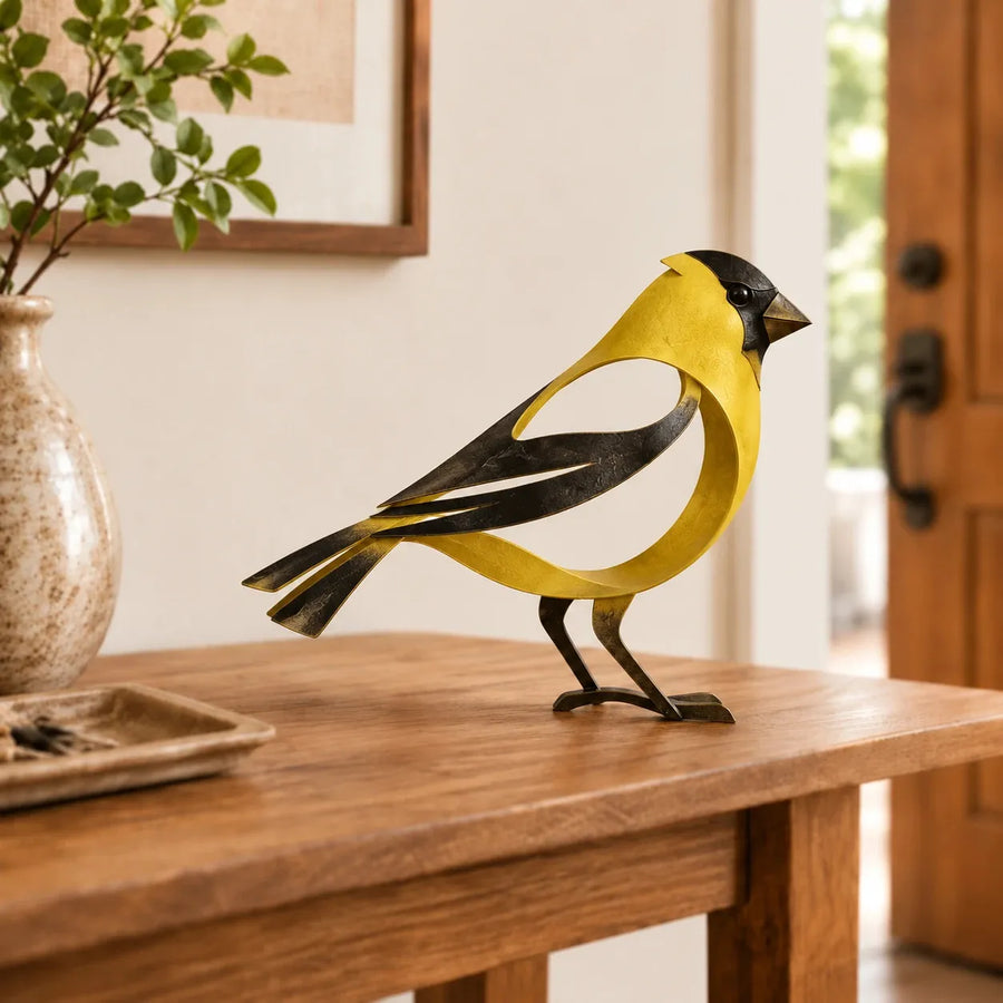 Yellow bird metal sculpture